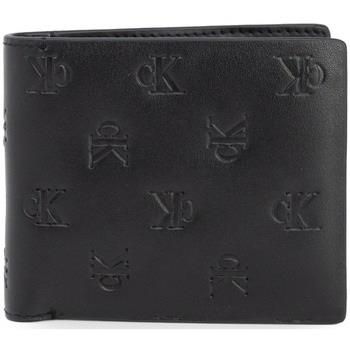 Lompakot Calvin Klein Jeans  AOP EMBOSS BIFOLD W/COIN K50K512064  Yksi...