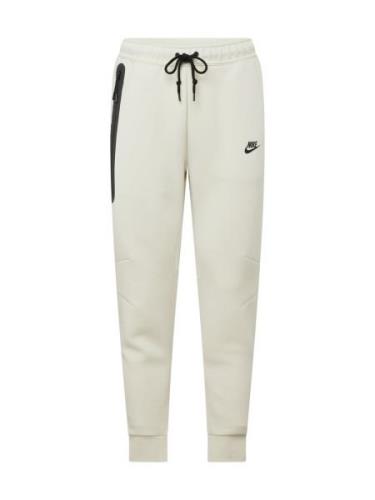 Nike Sportswear Housut 'TECH FLEECE'  pastellinvihreä / musta