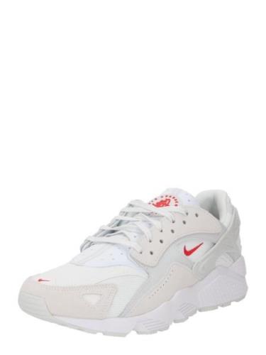 Nike Sportswear Matalavartiset tennarit 'AIR HUARACHE'  taupe / punain...